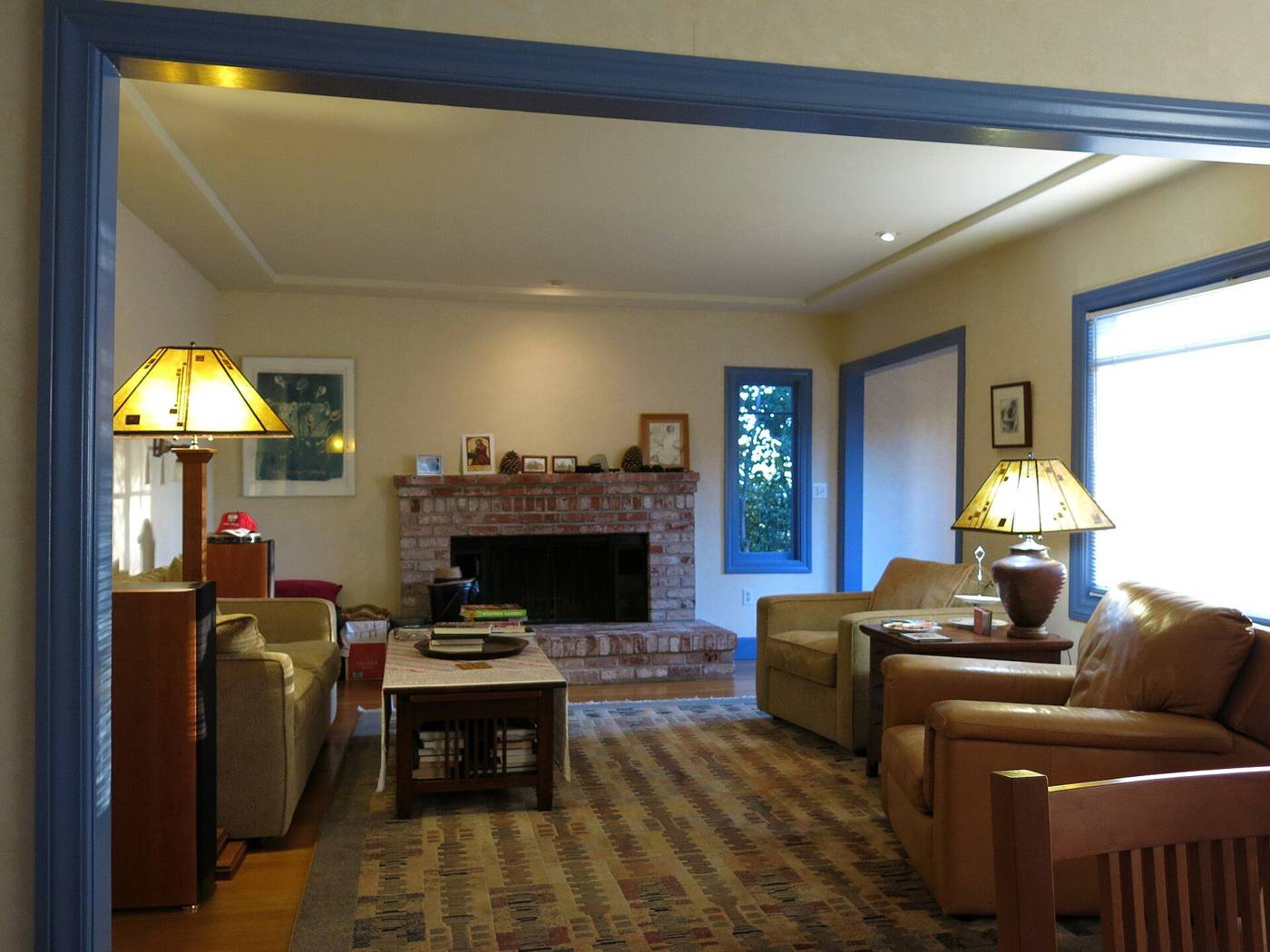 Cozy cottage living room with a fireplace and armchairs